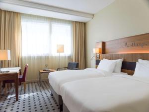 Voodi või voodid majutusasutuse Radisson Blu Airport Terminal Hotel toas