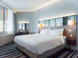 Voodi või voodid majutusasutuse Radisson Blu Airport Terminal Hotel toas