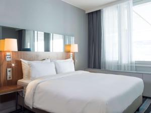 Voodi või voodid majutusasutuse Radisson Blu Airport Terminal Hotel toas