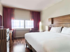 Voodi või voodid majutusasutuse Radisson Blu Airport Terminal Hotel toas