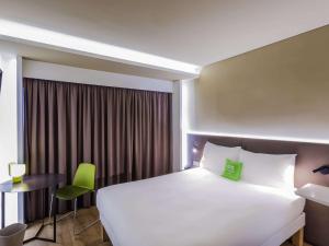 Llit o llits en una habitació de Ibis Styles Lisboa Centro Marquês de Pombal