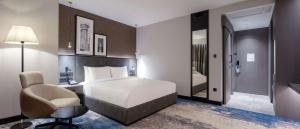 Postel nebo postele na pokoji v ubytování Radisson Hotel Izmir Aliaga