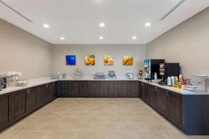 a large room with a counter in a pharmacy at Comfort Inn & Suites Balch Springs - SE Dallas in Balch Springs