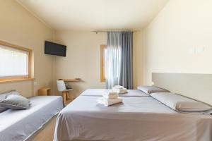 Posteľ alebo postele v izbe v ubytovaní Guest House La Sosta
