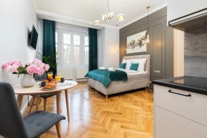 a living room with a couch and a table at Sopot RIVOLI Apartments by Renters in Sopot