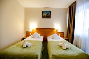 Postel nebo postele na pokoji v ubytování Hotel Rivulus