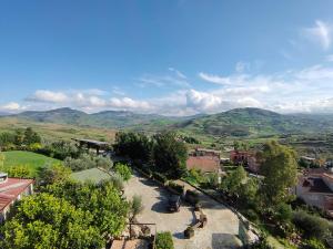 a view of a town with mountains in the background at Hotel La Rocca in Roccapalumba +2 photos