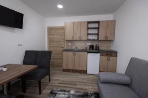 Kuchyň nebo kuchyňský kout v ubytování Vila Greta by Hotel Ramonda