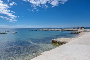 a view of the water with boats in a harbor at Beachfront Apartments Tolo with Pool in Novalja +24 photos