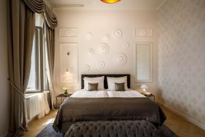 a bedroom with a large bed and a window at Hotel Imperial - Liburnia in Opatija