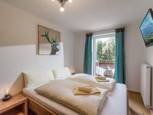 Posteľ alebo postele v izbe v ubytovaní Alpenresidenz Fieberbrunn