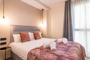 Home Art Apartments Soho客房内的一张或多张床位