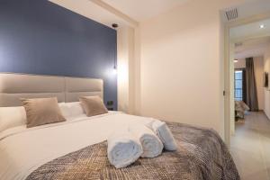 Home Art Apartments Soho客房内的一张或多张床位