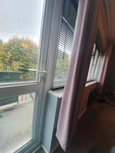 an open window with a view of a balcony at Central 2 bed apartment in Wolverhampton