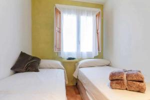 
Cama o camas de una habitación en Apartamento Can Trona 1B Turismo volcánico Vall de Bas
