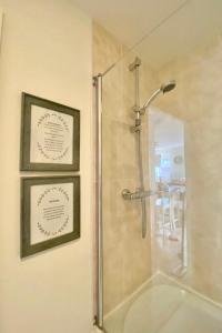 a shower stall in a bathroom with a tub at Chase Heights in Rugeley