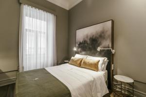 Uma cama ou camas num quarto em Royal Collection Covilh