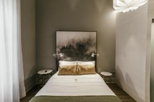 Uma cama ou camas num quarto em Royal Collection Covilh