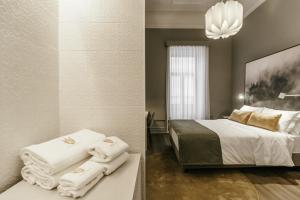 Uma cama ou camas num quarto em Royal Collection Covilh