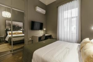 Uma cama ou camas num quarto em Royal Collection Covilh