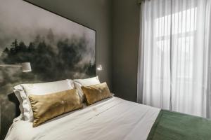 Uma cama ou camas num quarto em Royal Collection Covilh
