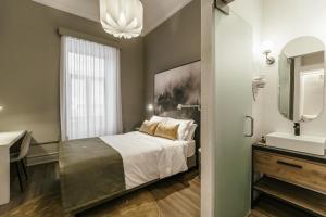 Uma cama ou camas num quarto em Royal Collection Covilh