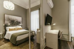 Uma cama ou camas num quarto em Royal Collection Covilh
