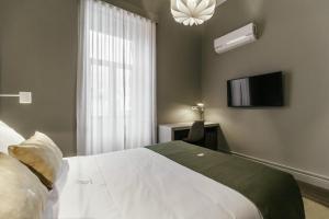 Uma cama ou camas num quarto em Royal Collection Covilh
