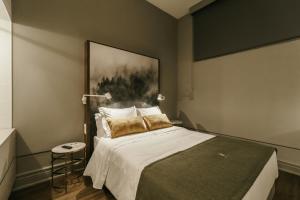 Uma cama ou camas num quarto em Royal Collection Covilh