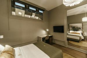 Uma cama ou camas num quarto em Royal Collection Covilh