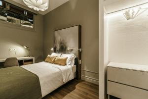 Uma cama ou camas num quarto em Royal Collection Covilh