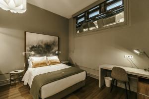 Uma cama ou camas num quarto em Royal Collection Covilh