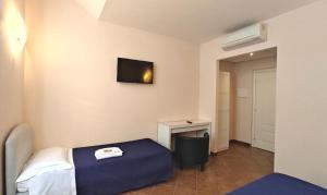 Postel nebo postele na pokoji v ubytování Hotel Rita Major