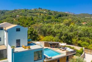 an aerial view of a house with a swimming pool at Villa Eleanna in Agnítsini