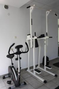 a gym with a treadmill and a exercise bike at Sirena Hotel- ALL INCLUSIVE in Sunny Beach