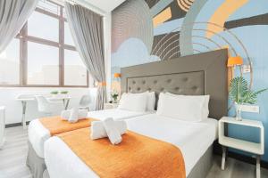 מיטה או מיטות בחדר ב-Oh Nice Revellin Ceuta