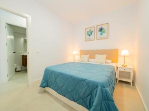 A bed or beds in a room at Cubo's Urban Miranda Apartment