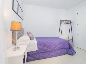 A bed or beds in a room at Cubo's Urban Miranda Apartment