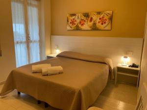 Postel nebo postele na pokoji v ubytování Hotel Ristorante Miramare