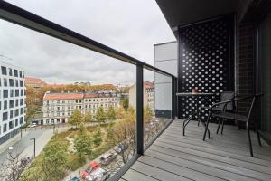 a balcony with a view of a city at Studio Księcia Witolda 32 by Renters in Wrocław