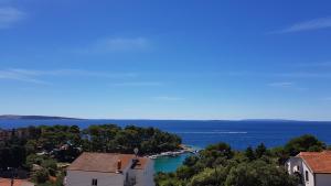 a view of the ocean from a building at Premium Appartments Suha Punta in Rab
