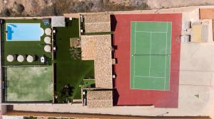 an overhead view of a tennis court and a tennis court at Casa Adara - Heated pool included in San Bartolomé