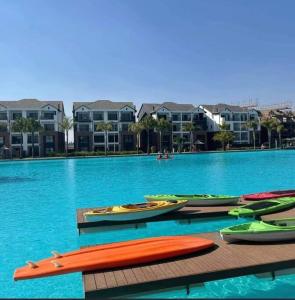 a group of kayaks sitting on a dock in the water at The Blyde Apartment 1287 in Pretoria