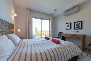 A bed or beds in a room at VILLA SALOBRE