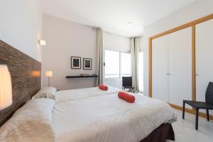 A bed or beds in a room at VILLA SALOBRE