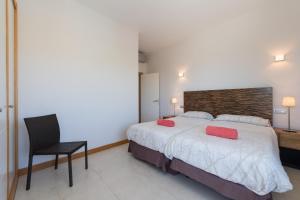 A bed or beds in a room at VILLA SALOBRE