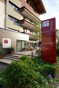 a building with a sign in front of it at Hotel Moserhof in Seeboden