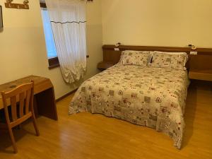 Voodi või voodid majutusasutuse Hotel Le Clou toas