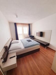 a bedroom with a large bed in a room at Apartmán 27, Kamzík in Donovaly +30 photos