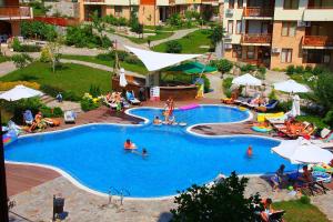 an overhead view of a swimming pool with people in it at Garden of Eden Complex in Sveti Vlas